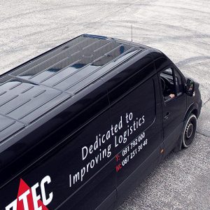 black aztec van with slogan on side