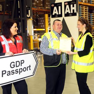 smiling staff with gdp passport sign
