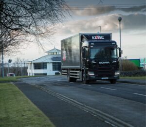 aztec black truck in motion